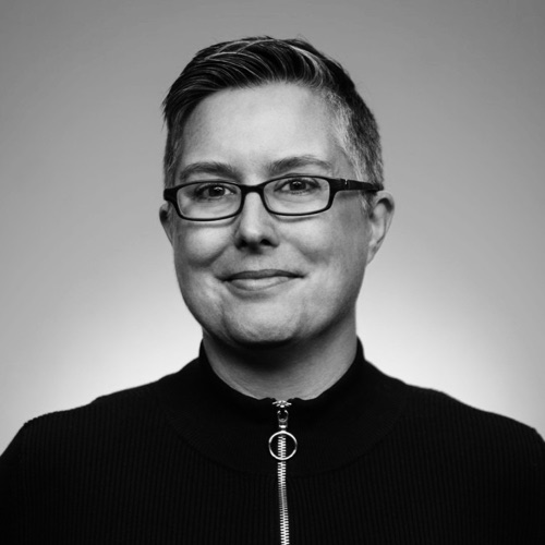Black-and-white portrait of Dr. Jill Casey, founder of Pain Rebels.